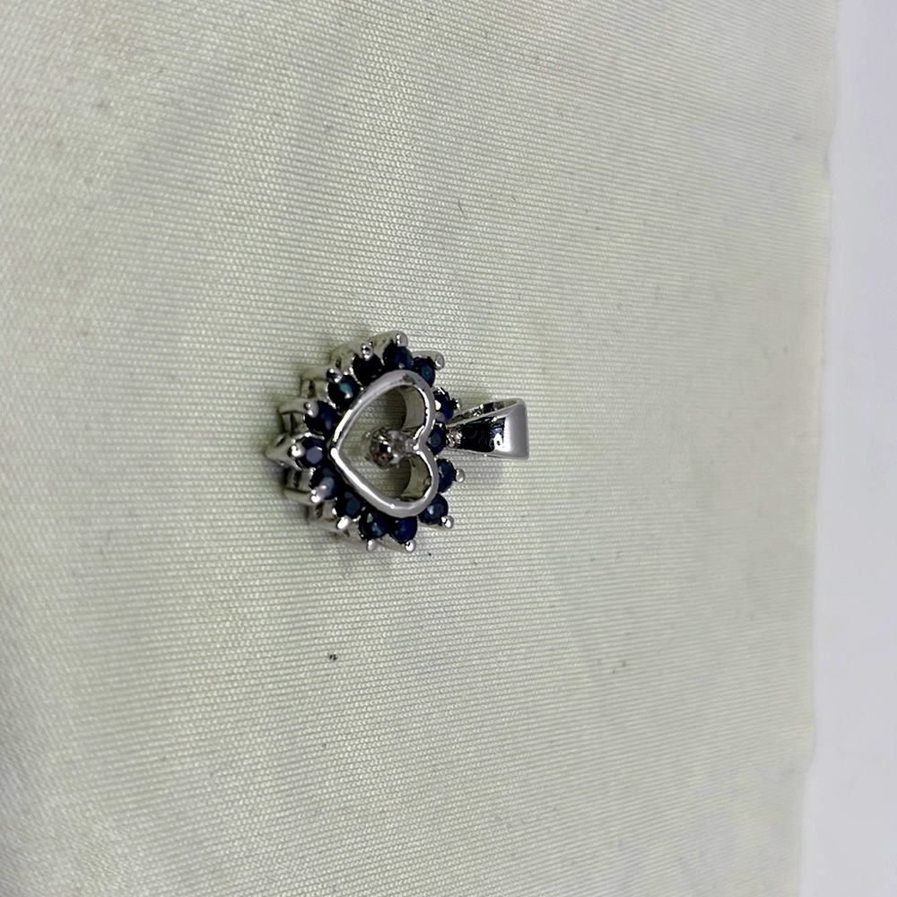 Lab grown sapphire heart pendant in silver